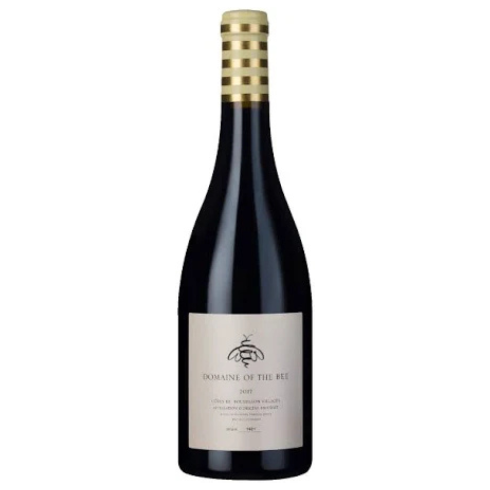 Wine bottle with gold foil cap on a white background